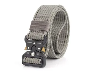 Close-up of quick-release tactical buckle with load capacity markings on nylon belt