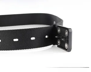 Detail of black nylon tactical belt showing adjustable holes and metal screw fixing