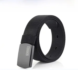 Detail of a black nylon tactical belt featuring a matte metal buckle with brand logo