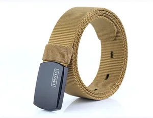 Detail of khaki nylon tactical belt with matte black buckle and textured woven strap