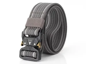 Close-up of black tactical alloy buckle with gold quick release lever on gray nylon belt