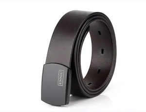 Detail shot of top grain leather tactical belt with smooth metal buckle and refined texture