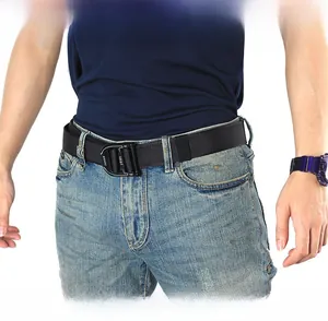 Close-up of black nylon tactical belt with quick-release alloy buckle on jeans