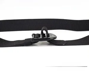 Detail of black nylon tactical belt with matte metal buckle for length adjustment