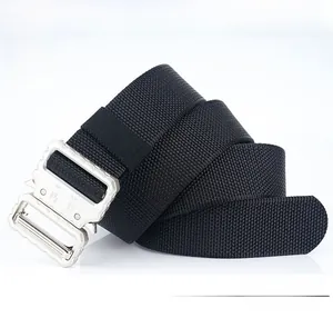 Detail of military tactical belt featuring heavy-duty nylon strap and silver cobra buckle