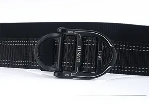 Macro detail of black tactical alloy buckle with quick release mechanism and brand engraving