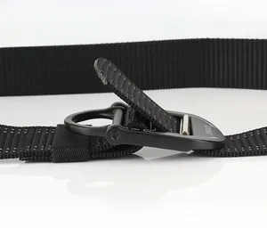 Detail of matte black zinc alloy quick-release buckle on a nylon tactical belt