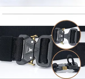 Detail of tactical nylon belt showing quick release metal buckle and dense weave texture