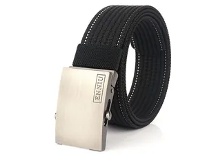 Detail view of the black nylon web belt featuring a brushed metal buckle and white stitching
