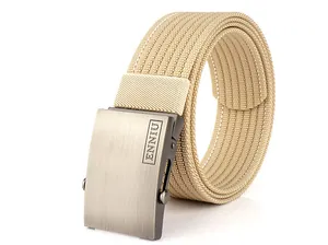 Detail of tan tactical nylon belt with brushed metal buckle and woven texture