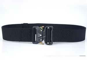 Detailed macro view of the black cobra tactical belt featuring the metal quick release buckle