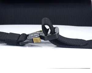 Detail of a tactical nylon belt with heavy-duty metal quick-release buckle and gold levers
