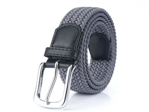 Detail of grey elastic woven canvas belt with silver pin buckle and black leather trim