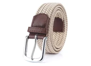 Detail of beige elastic woven belt with silver pin buckle and brown leather trim