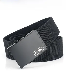 Detail of black woven canvas belt featuring matte black metal buckle and white TUSHI logo