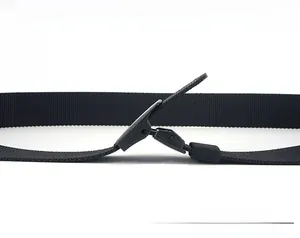 Detail view of black nylon tactical belt showing adjustable matte black flip buckle mechanism