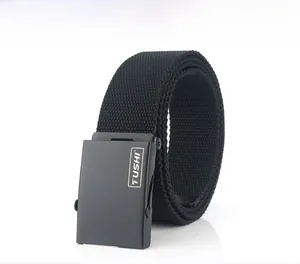 Detail of a black woven canvas belt with a matte black TUSHI metal buckle
