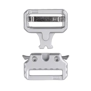 Macro detail of silver tactical metal buckle with quick release mechanism and engraved markings