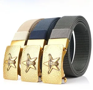 Detail of beige, navy, and grey nylon belts with golden bull-head automatic buckles