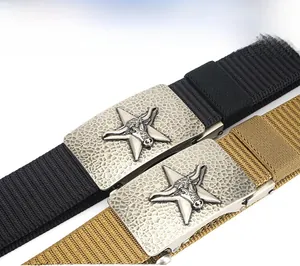 Detail of military nylon belt showing textured alloy buckle with embossed bull head