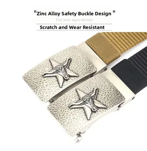 Close-up of zinc alloy belt buckle with textured star emblem and nylon woven webbing