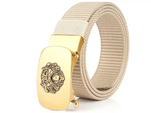 Detail of men's beige canvas belt featuring a gold automatic buckle with lion head relief