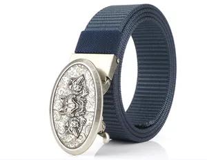 Detail of navy blue nylon belt featuring a silver buckle with embossed wolf head design