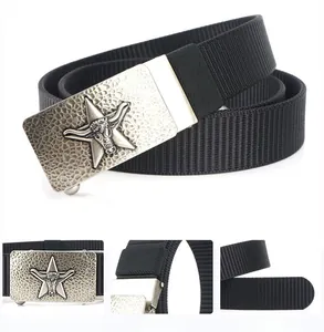 Detail of silver bull head buckle on black woven nylon belt with hammered metal texture