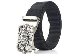 Macro detail of men's nylon belt featuring a 3D dragon totem embossed metal buckle