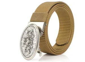 Detailed macro view of khaki nylon belt featuring a silver wolf head relief metal buckle