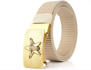 Detail shot of khaki nylon belt with a textured gold metallic buckle featuring a bull head star