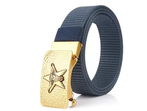 Detailed view of the gold bull head buckle on a dark blue woven nylon belt