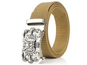 Macro detail of khaki nylon belt with vintage silver dragon-embossed automatic buckle