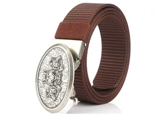 Close-up of brown nylon belt with silver alloy automatic buckle featuring wolf engravings
