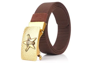 Detail of the golden automatic buckle with embossed bull head on brown nylon belt