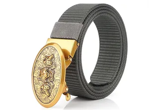 Detail of grey tactical nylon belt with gold buckle featuring embossed wolf design