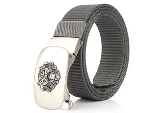 Close-up of silver automatic buckle with lion relief and grey nylon canvas belt strap