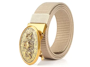 Close-up of khaki canvas belt featuring a gold metal buckle with wolf head relief