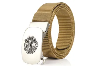 Detailed view of khaki nylon belt featuring a silver automatic buckle with lion head motif