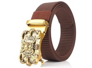 Close-up of golden automatic buckle with embossed dragon pattern on brown nylon belt