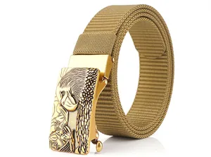 Detail of khaki nylon belt featuring an embossed golden eagle pattern on the metal buckle