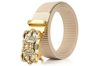 Detail of khakhi nylon belt featuring a gold metal buckle with an intricate dragon relief
