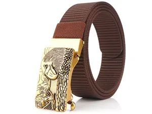 Detail of golden eagle buckle on thick brown nylon tactical belt for men