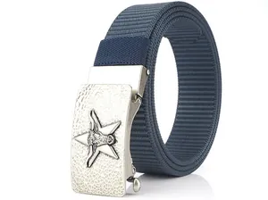 Detail of navy nylon belt with vintage silver star and bull head metal buckle