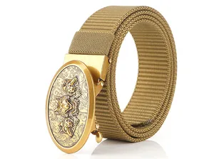 Close-up of golden alloy buckle with three-wolf relief on khaki nylon tactical belt