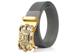 Detail of grey nylon belt featuring a golden metallic 3D dragon embossed buckle