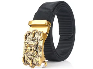 Detail of black nylon tactical belt with a golden metallic dragon relief automatic buckle