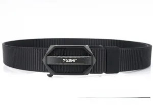 Close-up of matte black metal quick-release buckle with tank track nylon belt texture
