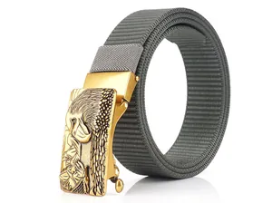 Detailed view of grey nylon belt with gold metal automatic buckle featuring eagle relief