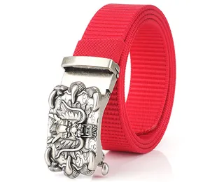 Detail of red nylon belt featuring an antique silver dragon head buckle with embossed relief